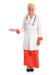 Full body young Muslim female doctor portrait, showing welcome hand sign standing isolated on white background.