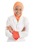 Young Muslim female nurse portrait, crossed arms standing isolated on white background.