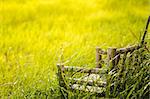 Bamboo wooden chairs on grass field in countryside Thailand