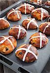 Easter hot cross buns on a baking sheet