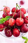 Fresh wet cherry in a glass, close up