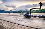 fishing tackle on a wooden float with mountain background