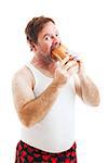 Middle aged man in his underwear, stuffing his face with a giant hoagie sandwich.  Isolated on white.