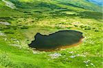 Image of a beautiful mountain lake in carpathian mountains. Chornohora massif in eastern Carpathians.