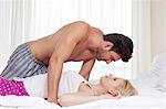 Side view of passionate young couple in bed