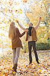 Full length of couple enjoying in autumn