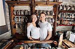 Portrait of happy couple standing together in tea store