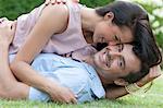 Portrait of loving young couple enjoying together in park