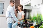 Romantic couple in kitchen