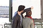 Tourists looking at map