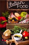 Delicious italian food ingredients in a wooden rustic box.