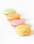 Delicious french macarons on a white background.