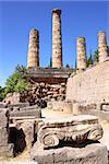Ancient column and ruins of Temple of Apollo in the archaeological site of Delphi, Greece