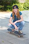 Cool young girl outdoor with skateboard