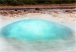 Initial phase of an eruption of Strokkur, famous Icelandic geyser