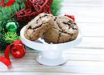 cookies with chocolate on a wooden background with Christmas tree branches and decorations