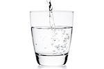 glass with pure water and bubbles on white background