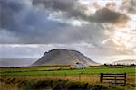 Rainstorm over a farm in Iceland