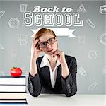 Thinking redhead teacher against red apple on pile of books in classroom