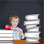 Cute pupil holding glasses against red apple on pile of books