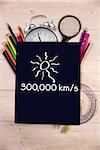 Distance to the sun against students desk with black page