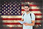 Student using tablet pc against usa flag in grunge effect