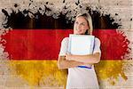 Mature student smiling against germany flag in grunge effect