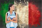 Student holding tablet pc against italy flag in grunge effect