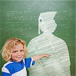 Composite image of cute pupil with graduate outline in classroom