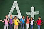 Elementary pupils running against green chalkboard with a plus grade