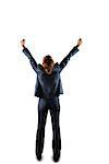 Sucessful businesswoman in suit cheering on white background