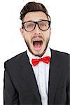 Nerdy businessman shouting with mouth open on white background