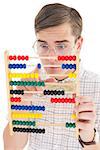 Nerdy hipster adding on abacus on white background