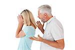 Angry man shouting at his wife on white background