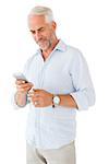 Smiling man sending a text message on white background