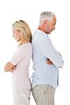 Unhappy couple not speaking to each other on white background