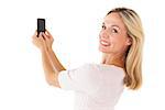 Happy blonde sending a text message on white background