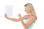 Angry blonde looking at page on white background