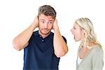 Man not listening to his shouting girlfriend on white background