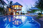 South America, Brazil, Alagoas, Praia do Riacho, sun loungers around the pool at the Pousada Riacho Dos Milagres boutique hotel PR