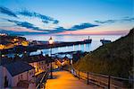 United Kingdom, England, North Yorkshire, Whitby. The harbour at dusk from the 199 Steps.