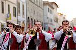 Italy, Tuscany , Pistoia. Trumpeters play a fanfare during the annual parade in the historic centre for the feast of San Jacopo.