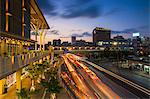 Traffic passing Asahibashi monorail station in downtown Naha, Okinawa, Japan