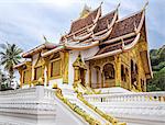 Laos, Luang Prabang, Luang Prabang Province. The fine temple in the grounds of the Haw Kham Royal Palace complex was built in the traditional style of Luang Prabang architecture.