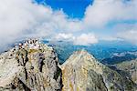 Europe, Poland, Carpathian Mountains, Zakopane, hikers on summit of Mt Rysy, 2499m highest point in Poland