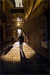 Sunny morning light in Carrer del Bisbe, Barcelona, Catalonia, Spain