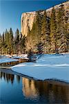 Scenic winter landscape with El Capitan mountain reflected in the river, Yosemite National Park, California, USA