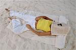 Woman sleeping on beach