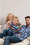 Family sitting on couch