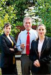 Confident business trio outdoors